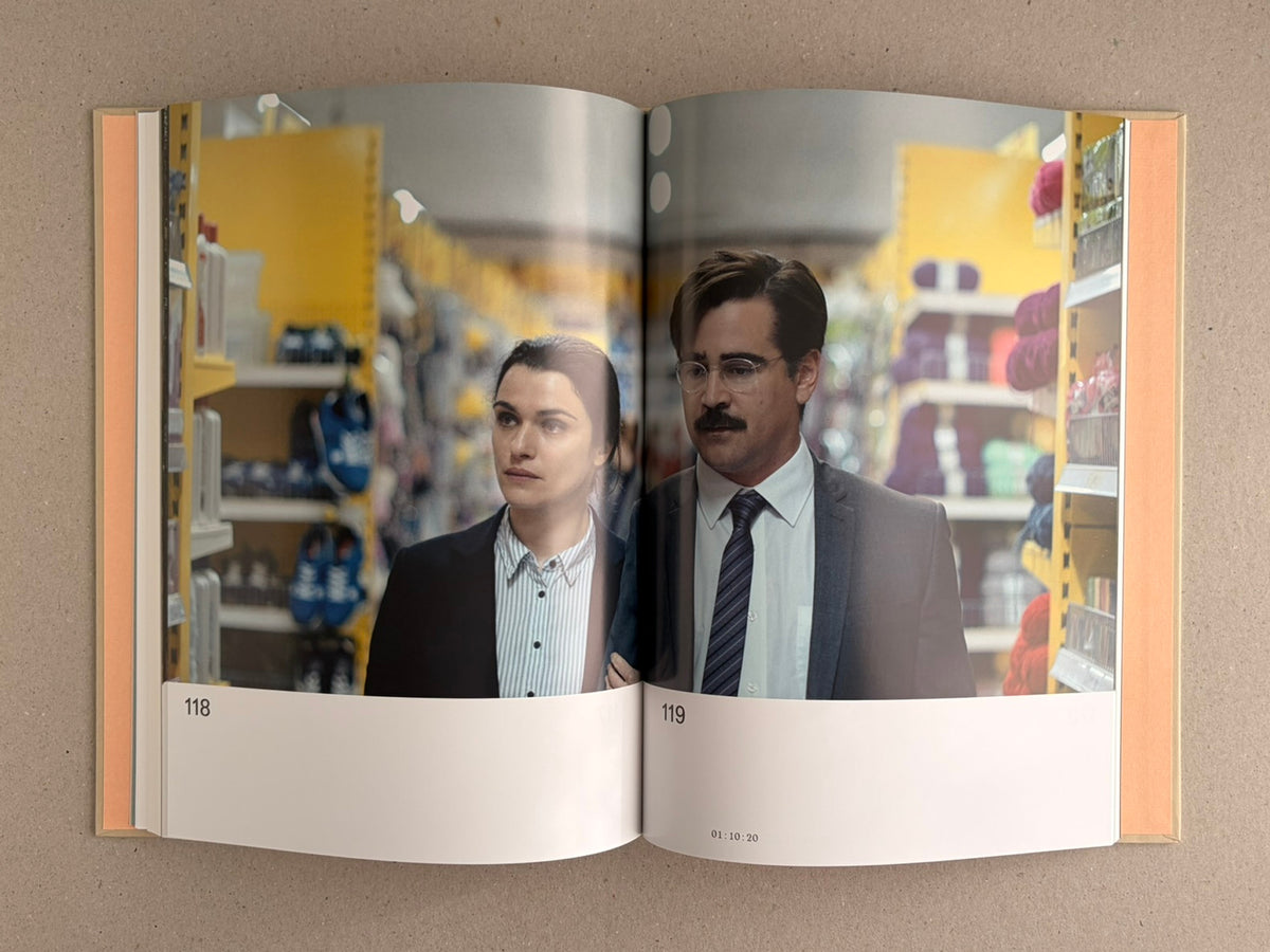 Open spread from The Lobster Screenplay Book by Yorgos Lanthimos, showing pages 118 and 119 with a film still of two people standing in a store aisle.