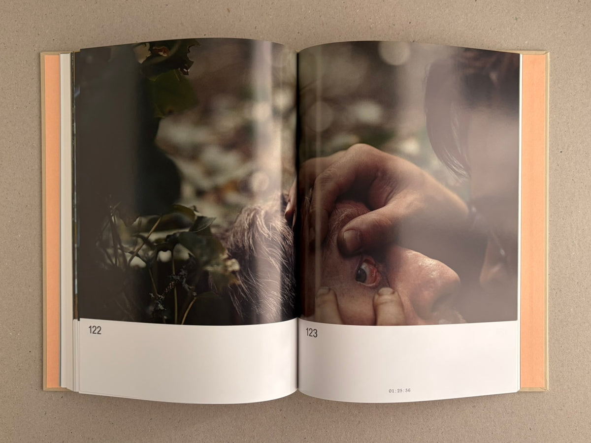 Open spread from The Lobster Screenplay Book showing pages 122-123, with a film still and page number 01:25:56.