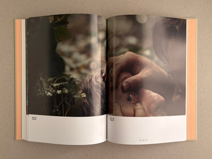 Open spread from The Lobster Screenplay Book showing pages 122-123, with a film still and page number 01:25:56.