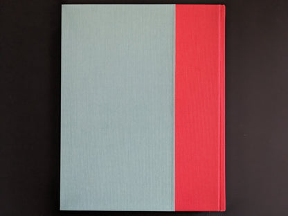 Back cover of Stephen Gill’s photobook The Pillar, cloth-bound in light blue and red