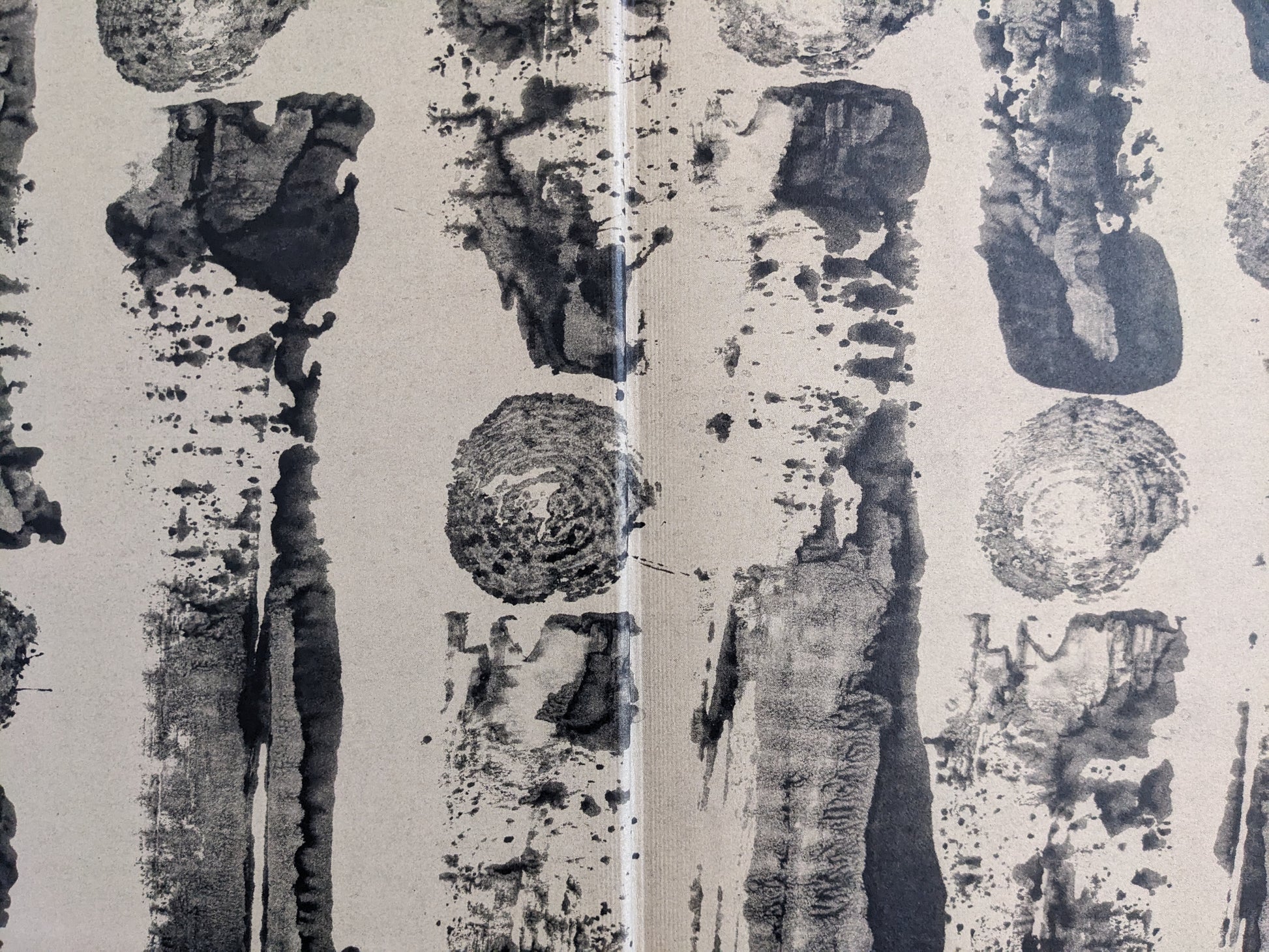 Endpaper of The Pillar by Stephen Gill, abstract black ink tree ring and bark patterns on beige background