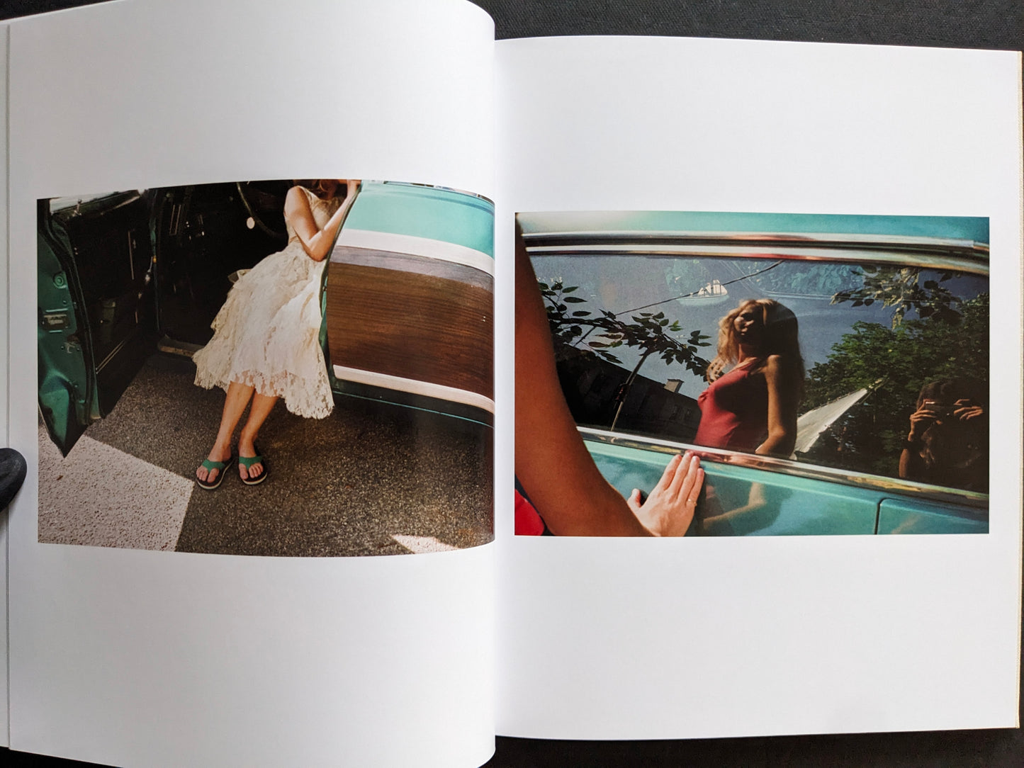 Interior spread from The Virgin Suicides book with candid photographs of a girl stepping out of a car and a reflected portrait in a car window.