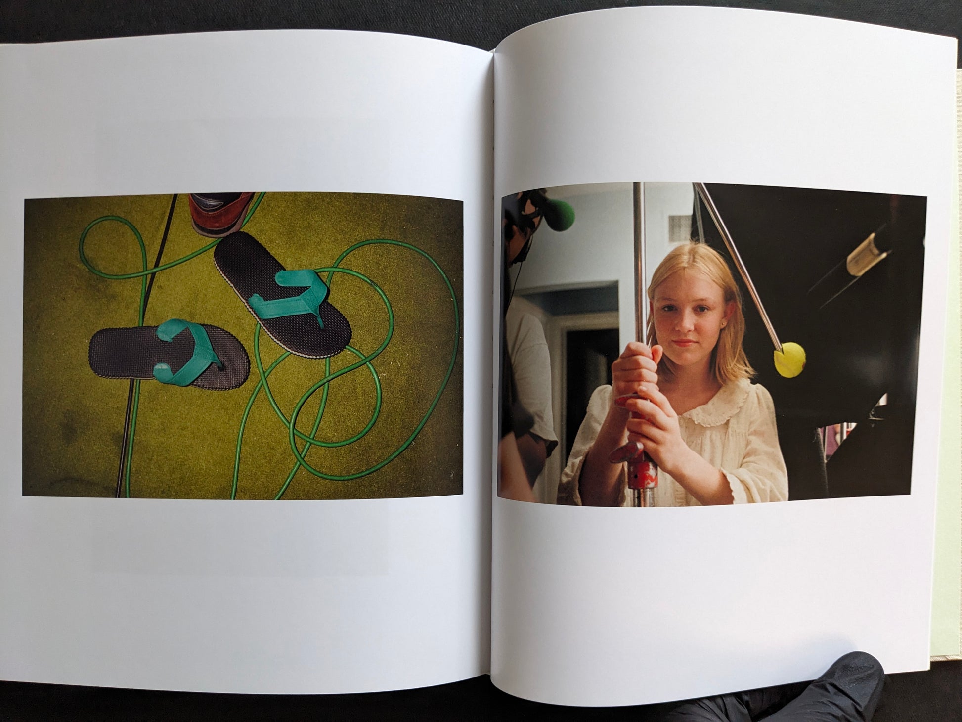 Interior spread from The Virgin Suicides book showing a still life of flip-flops and a behind-the-scenes portrait of a young actress holding film equipment.