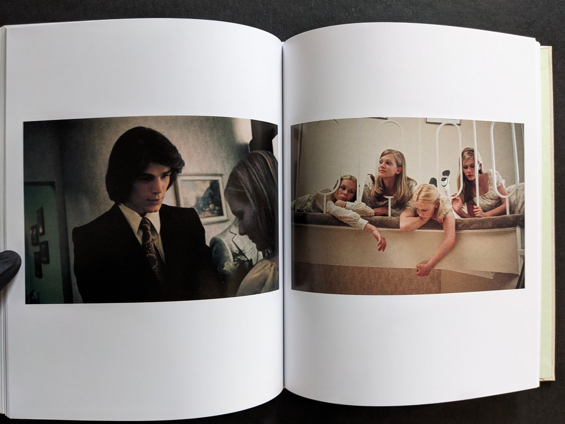 Interior spread showing a young man in a suit and the sisters leaning over a bunk bed.