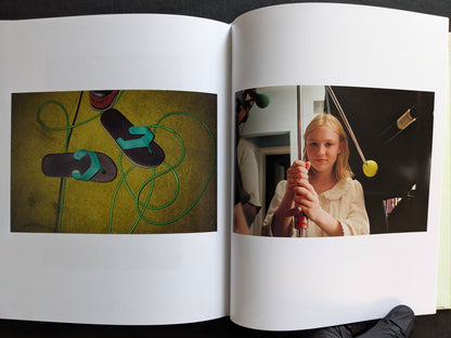 Interior spread with a still life of flip-flops and a behind-the-scenes portrait of a young actress holding film equipment.