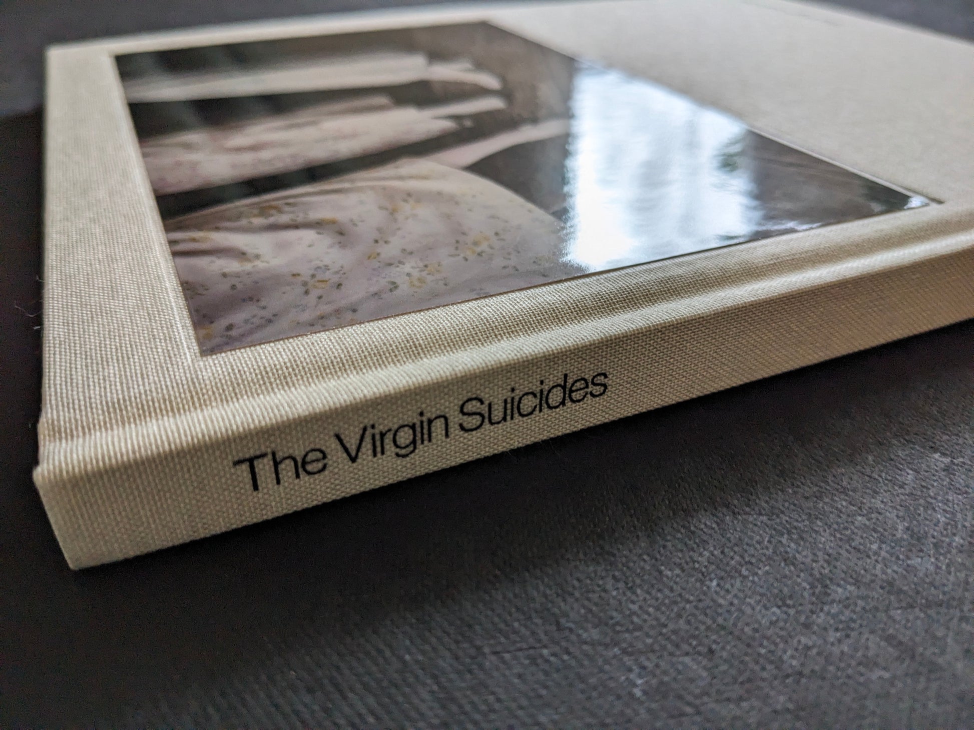 Close-up of the spine and clothbound cover of The Virgin Suicides book by Sofia Coppola.