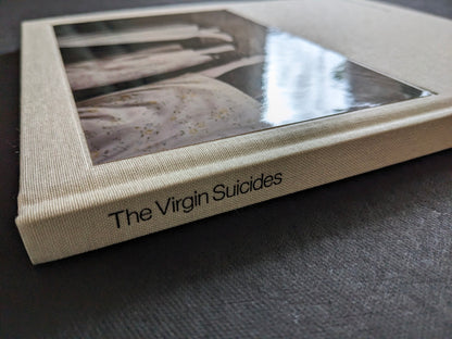Close-up of the spine and clothbound cover of The Virgin Suicides book by Sofia Coppola.
