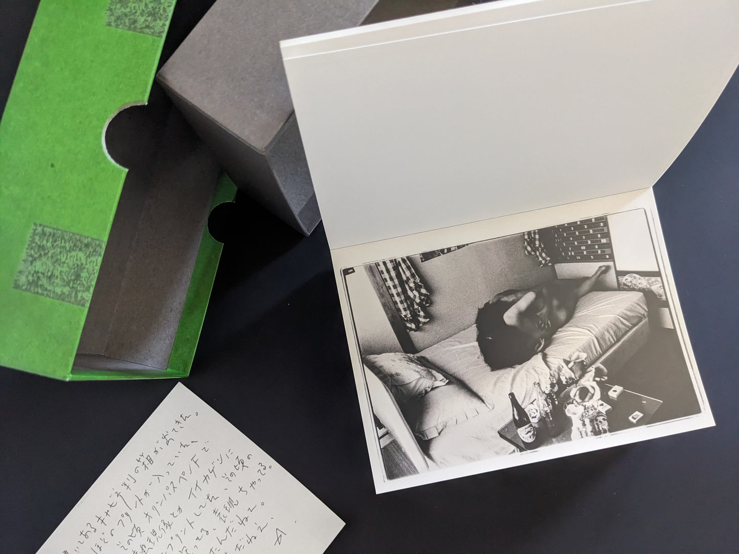 Black-and-white print of a nude couple in a Japanese bedroom