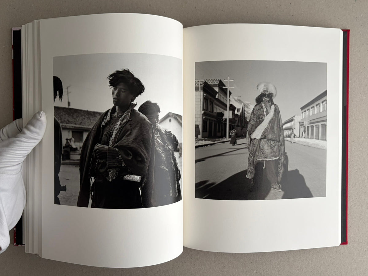 Open photobook spread with two black-and-white portrait photographs, Tibet – Shinya Arimoto