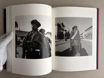 Open photobook spread with two black-and-white portrait photographs, Tibet – Shinya Arimoto