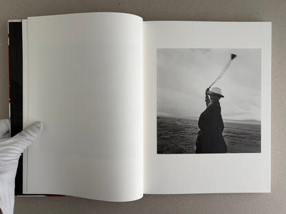 Open photobook spread with a black-and-white portrait on the right page, Tibet – Shinya Arimoto