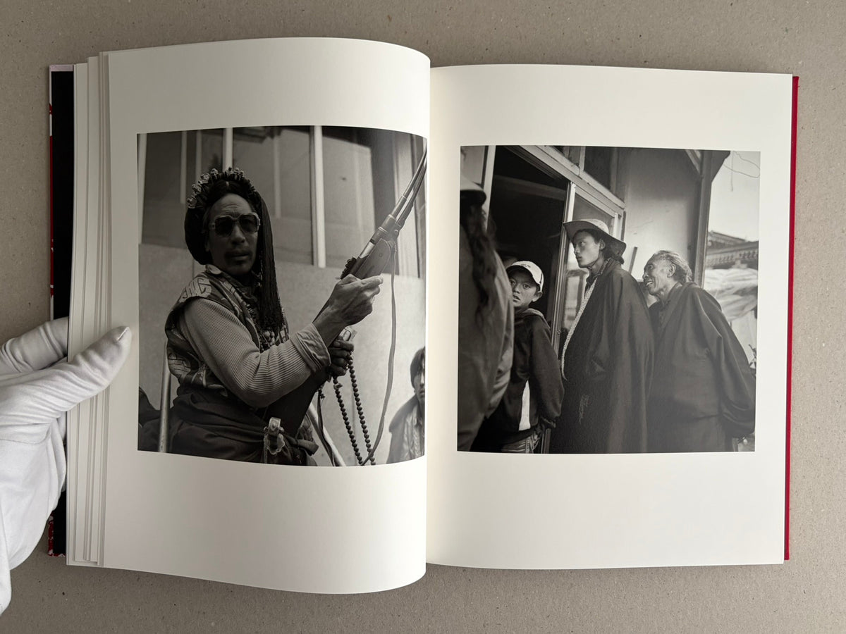 Open photobook spread with black-and-white portraits, Tibet – Shinya Arimoto