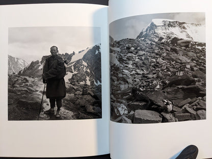 Spread from “TIBET” with a close view of an animal skull among rocks and a portrait of a man standing in a rocky mountain landscape.