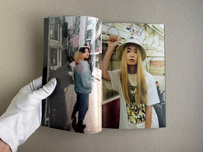 Tokyo Girls by Emily Ashcroft, open spread with a street portrait and an indoor portrait