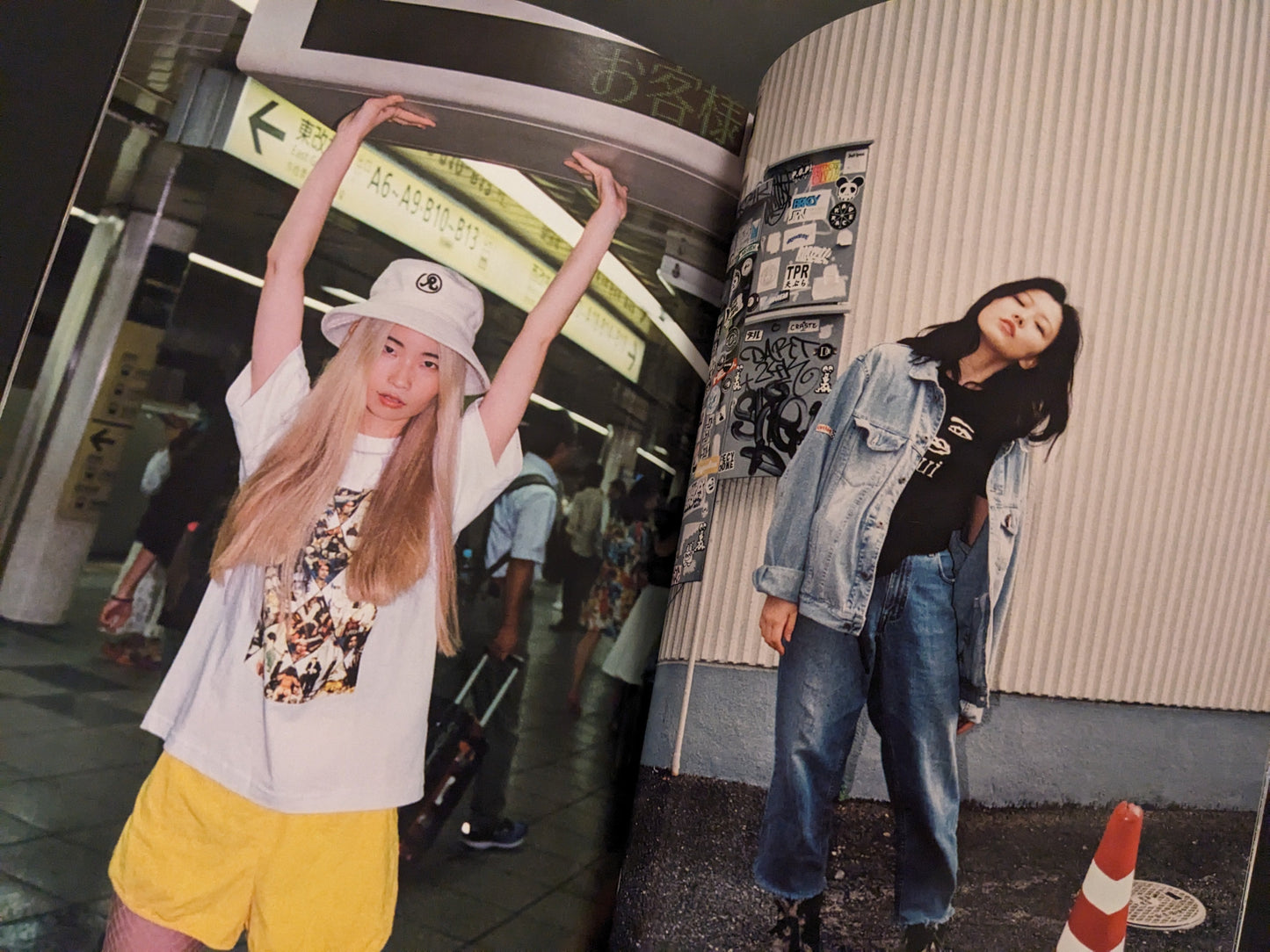 Two women in an urban Tokyo setting, one walking down the street, another posing in a subway station wearing a white hat and yellow shorts.