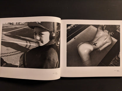 Open spread with a bare-backed figure with a butterfly tattoo and a young woman standing on a city street.