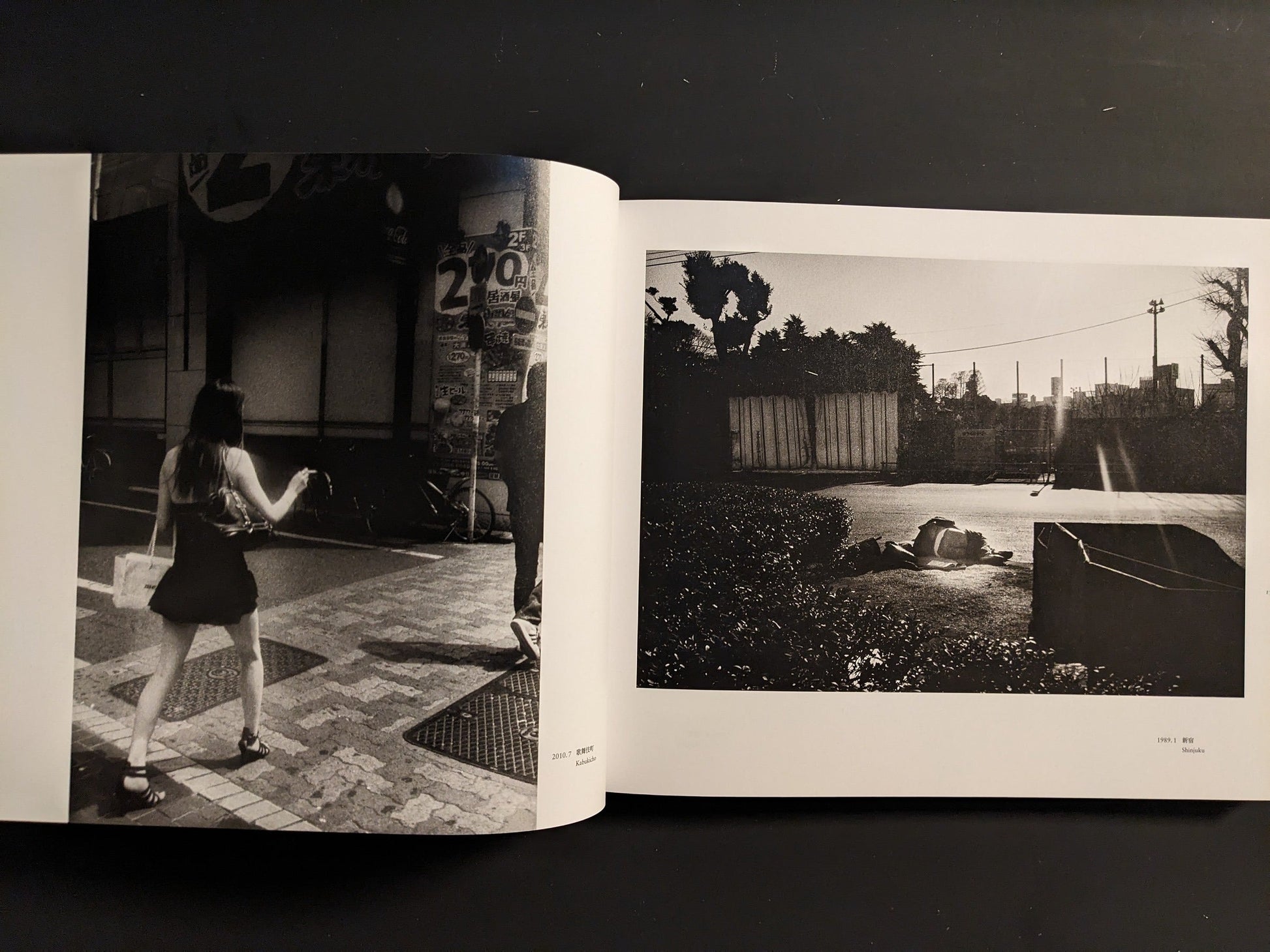 Open spread pairing a sunlit open space with a distant figure and a woman walking along a tiled Tokyo sidewalk.