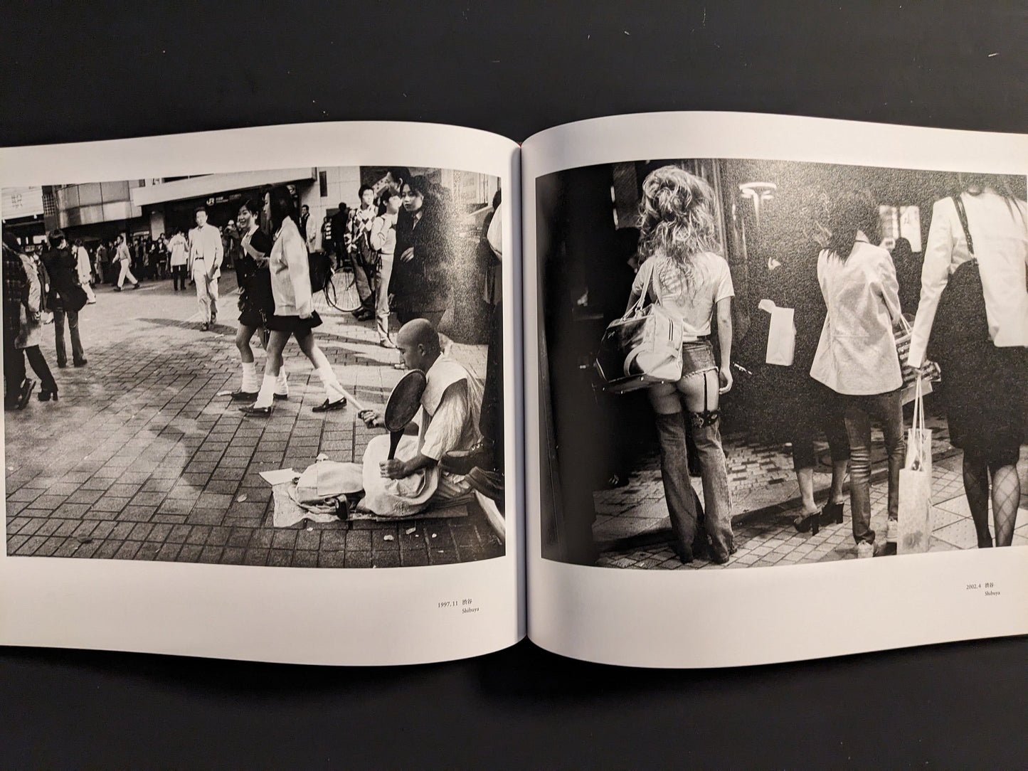 Spread from “Tokyo on the Brink of Sanity” showing a seated street beggar on a busy pavement and a rear view of a woman walking through a crowded shopping street.