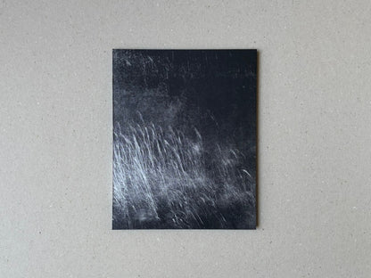 Cover of torikumo by Haruka Fujita, showing a dark abstract photographic image on a square-format book