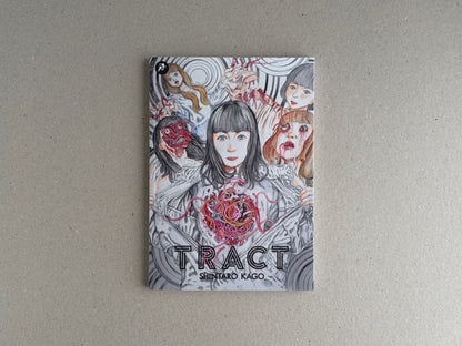 Front cover of TRACT by Shintaro Kago, showing a collage of illustrated faces and organic forms.