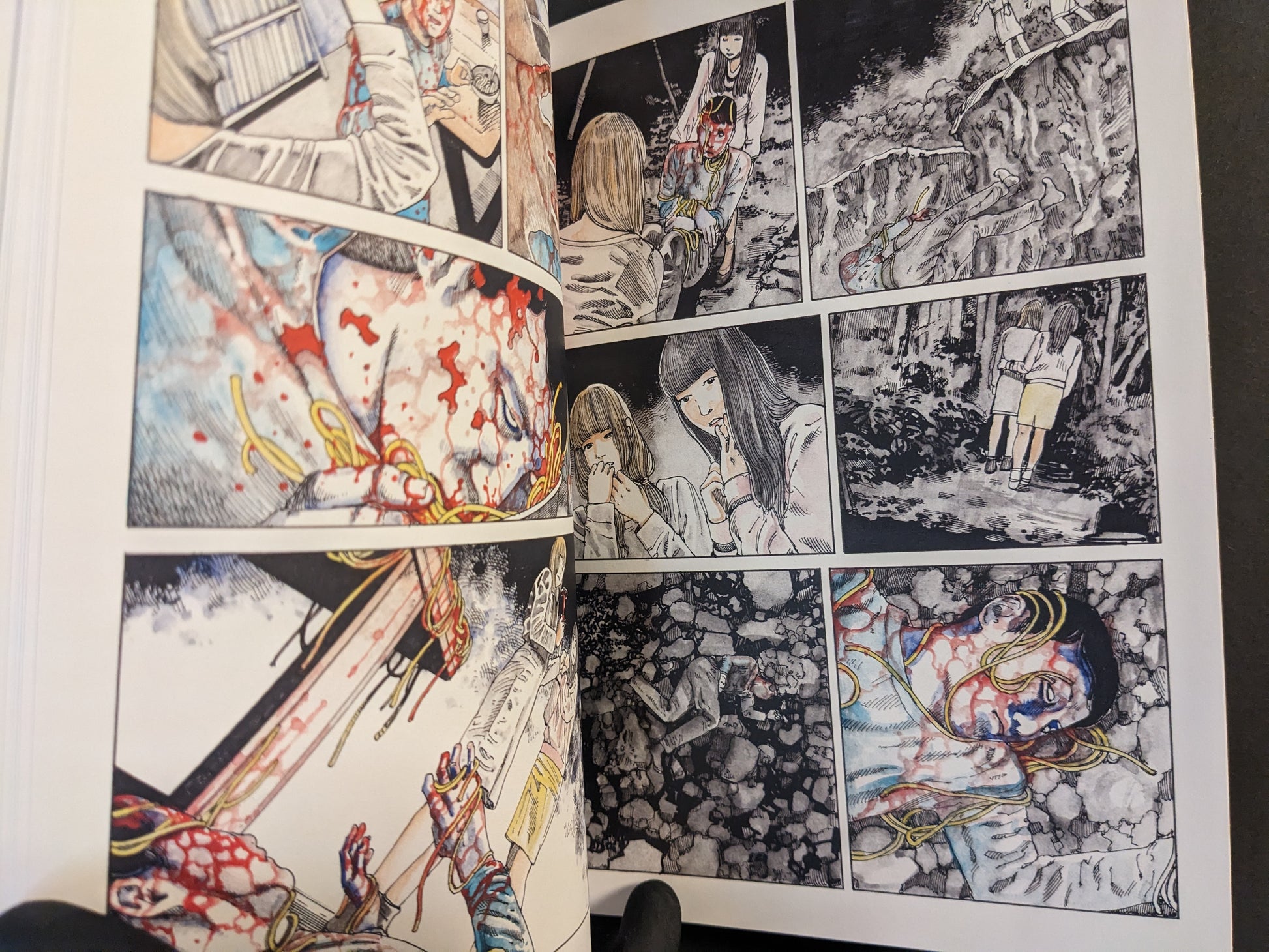 Interior spread with dramatic manga scenes and graphic elements.
