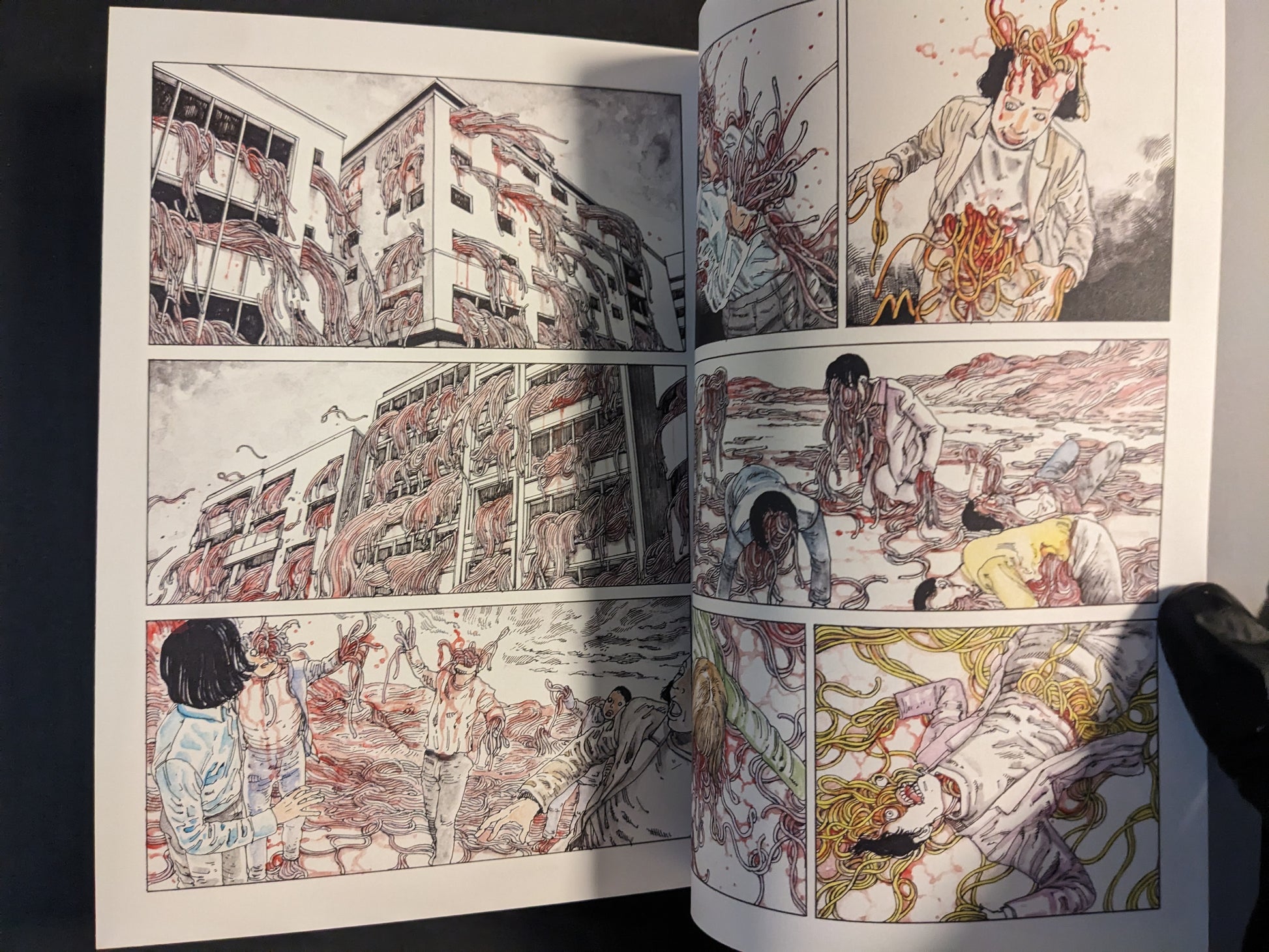 Interior spread with cityscape panels and surreal organic forms.