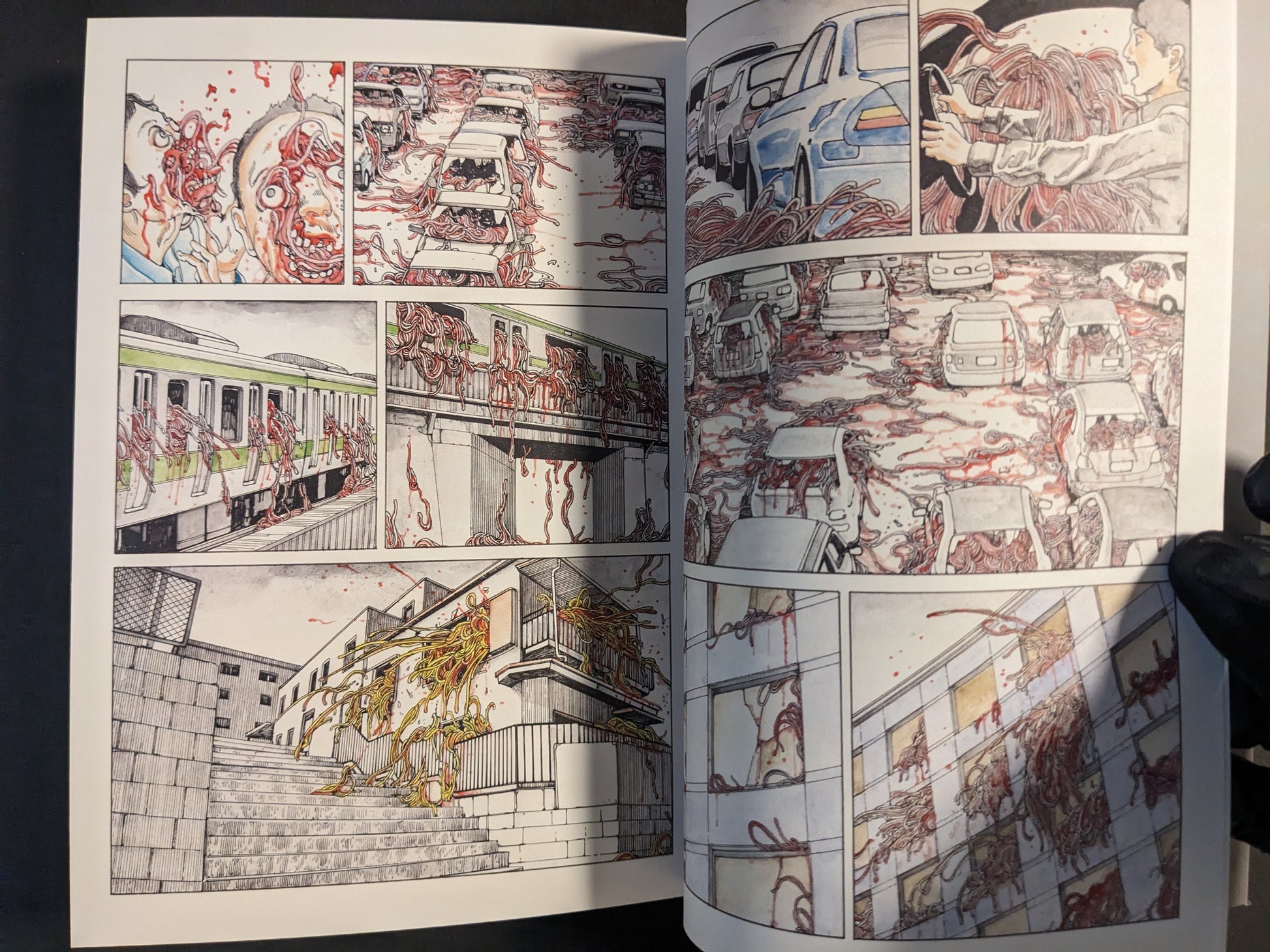 Interior detail with vehicles, trains, and surreal elements.