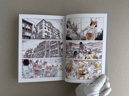 Open TRACT (pocket edition) by Shintaro Kago, showing a full-colour interior spread with multiple comic panels and a gloved hand holding the lower right corner.