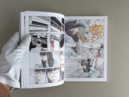 Open TRACT (pocket edition) by Shintaro Kago, showing interior comic pages with a woman in glasses and close-up panels.