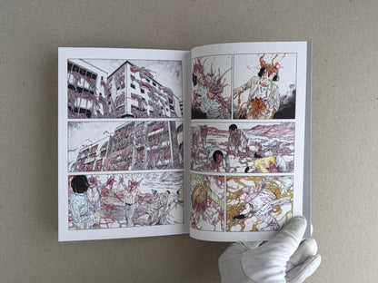 Open TRACT (pocket edition) by Shintaro Kago, showing a two-page interior comic spread with multiple panels and a gloved hand holding the book open.