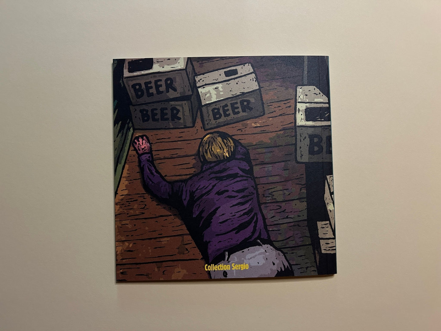 Back cover of Traumavision by Pierre La Police, showing a figure crawling on a wooden floor beneath beer crates and the Collection Sergio label.