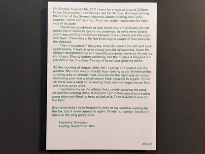 Back cover of TTP by Hayahisa Tomiyasu, showing text excerpt printed in green on white background.