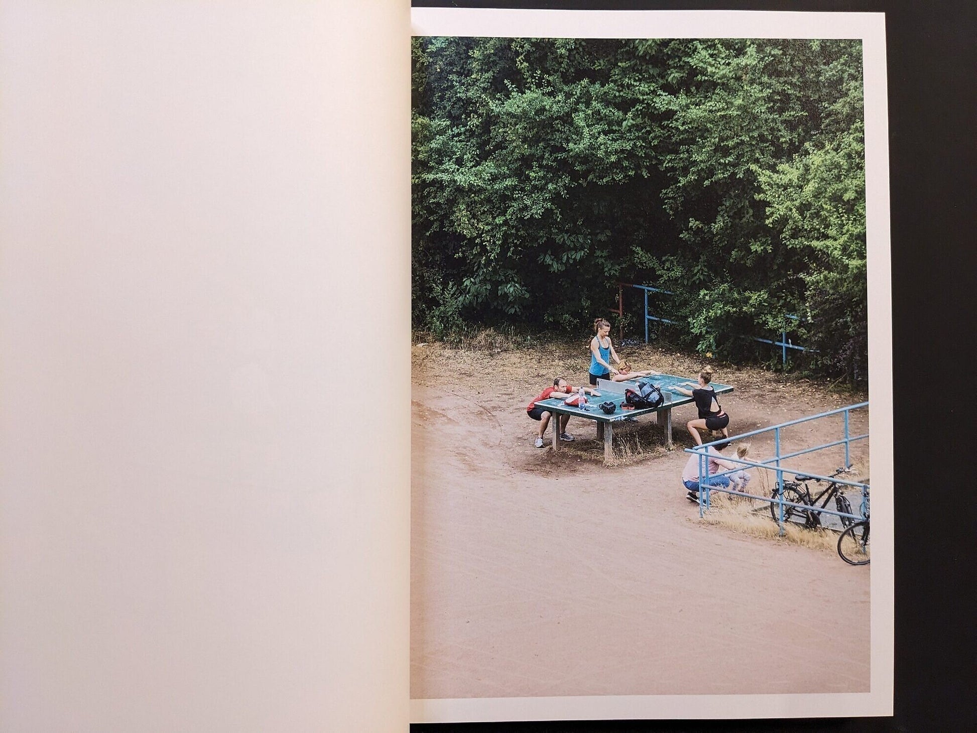 Interior spread showing people resting around a ping-pong table in Leipzig.
