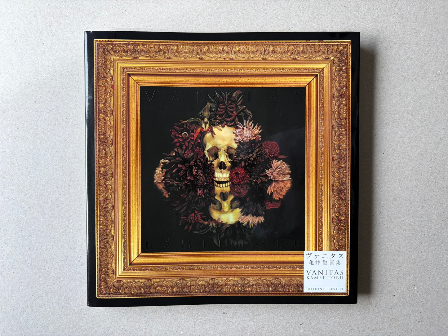 VANITAS by Toru Kamei, front cover with a framed skull and flowers on a black background, Editions Treville label at lower right.