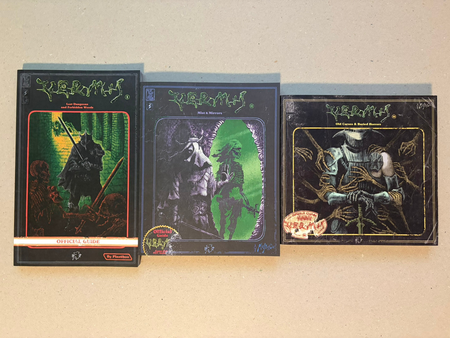 Vermis I–III Regular Edition Set: three Hollow Press books by Plastiboo shown front cover up on a plain surface, with Vermis I, Vermis II, and Vermis III arranged side by side.
