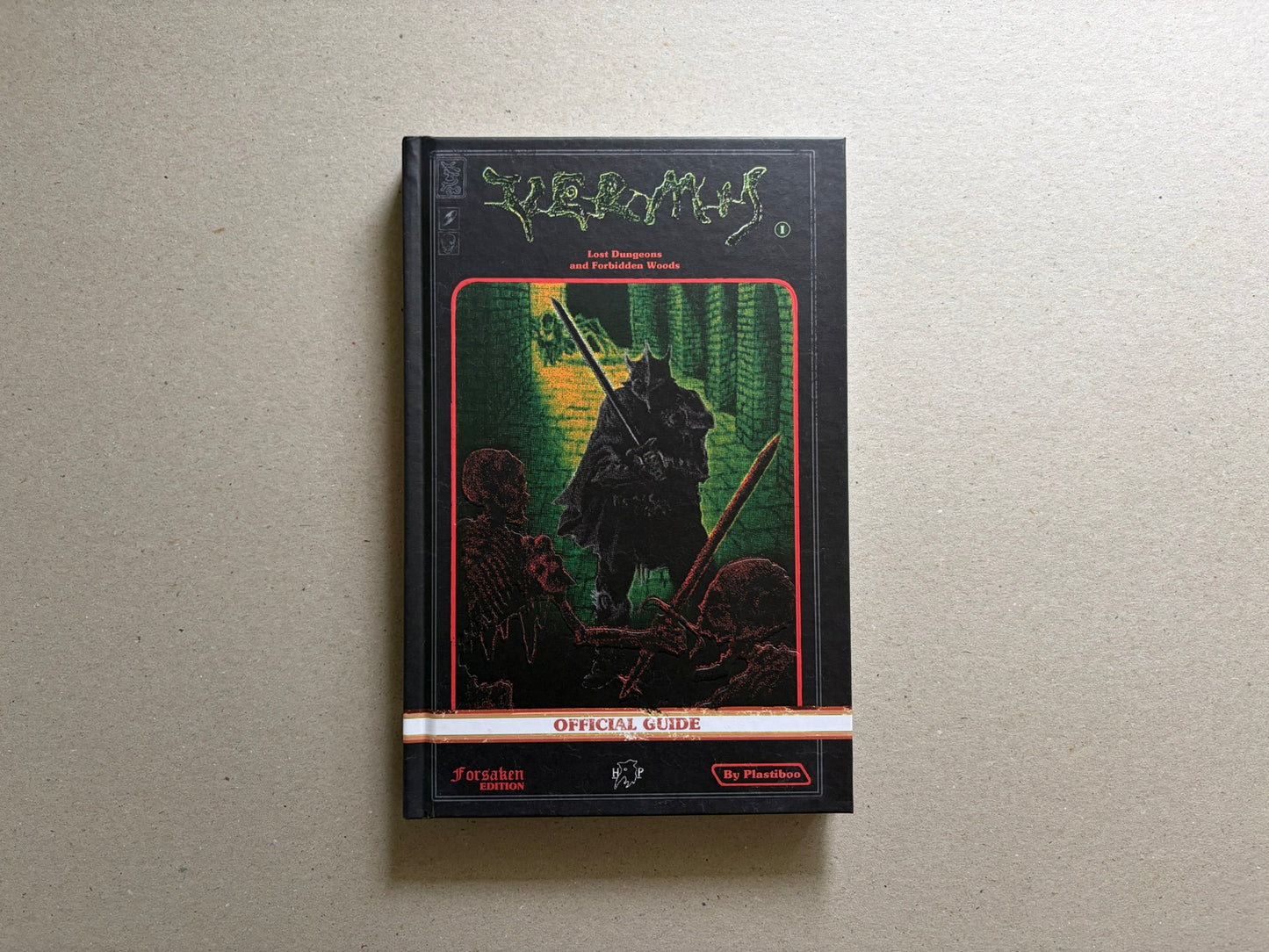 Front cover of Vermis I – Lost Dungeons and Forbidden Woods (Forsaken Edition), black hardcover with green title lettering and a central dungeon illustration.