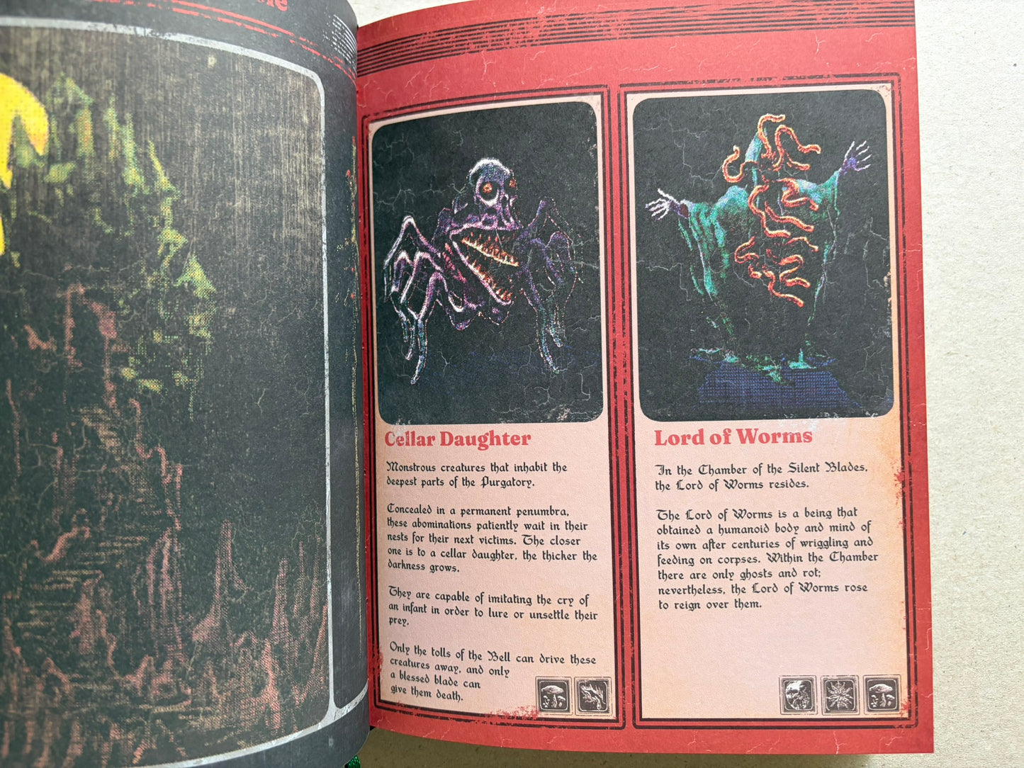 Interior spread with two creature panels labeled 'Cellar Daughter' and 'Lord of Worms' beside a dark page edge.