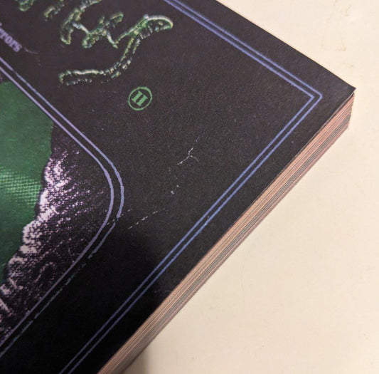 This copy has a minor cosmetic defect on the cover (a small crease/bump on the corner)