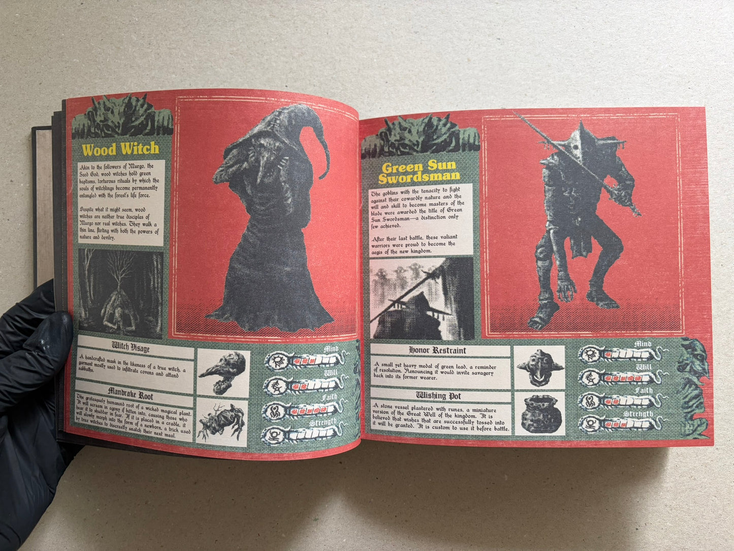 Open Vermis III Forsaken Edition spread showing two red pages with creature illustrations and text panels.