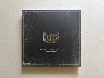 Vermis III back cover on a light tabletop, showing the black rear cover with the centered question and price mark.