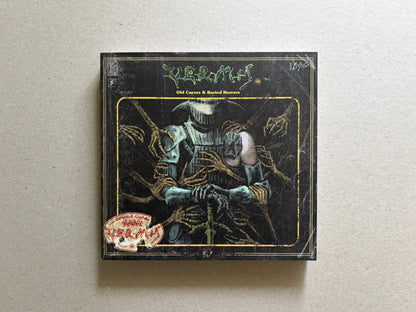 Vermis III cover on a light tabletop, showing the black front cover with the title and central armored figure illustration.