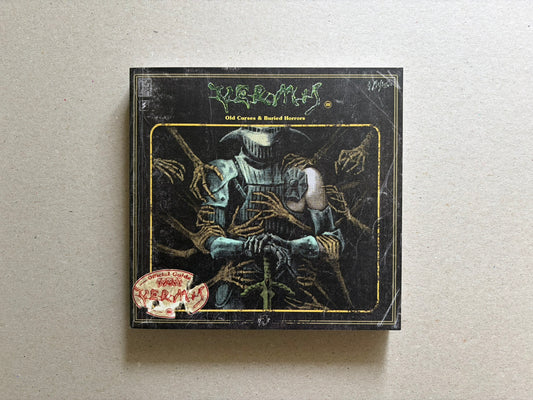 Vermis III cover on a light tabletop, showing the black front cover with the title and central armored figure illustration.