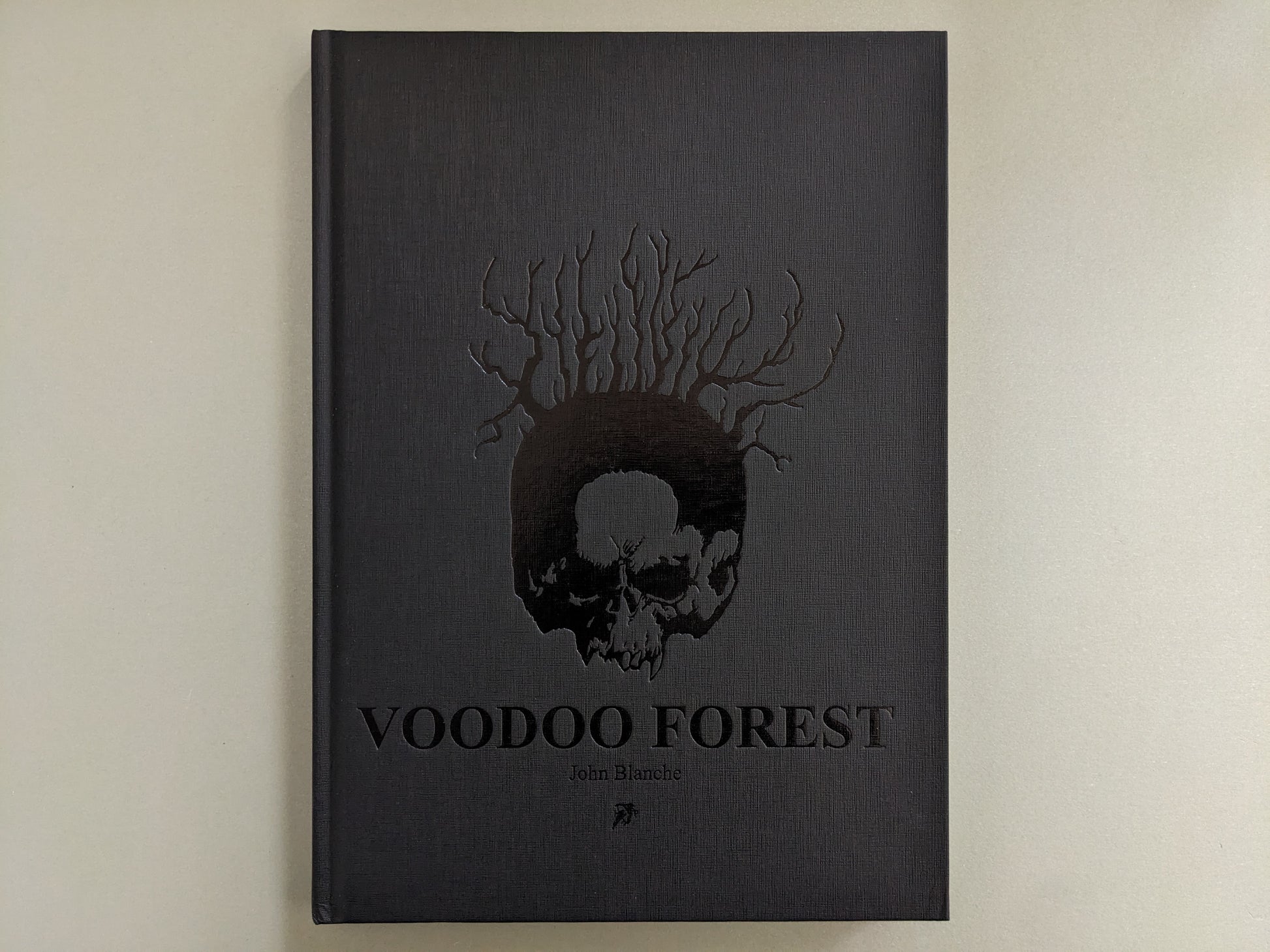 Front cover of 'Voodoo Forest' by John Blanche with embossed skull and tree roots