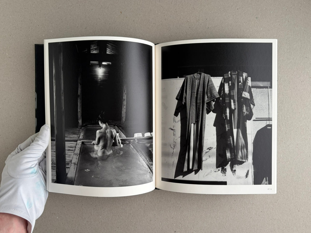 Wandering Dog by Mai Nakama, open photobook spread with two black-and-white photographs