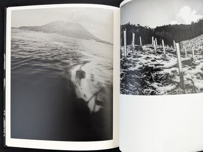 Black and white photograph of rural seascape with water reflections from Wandering Dog