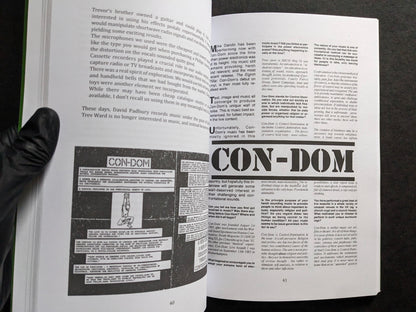 Interior spread featuring Con-Dom and cassette artwork.