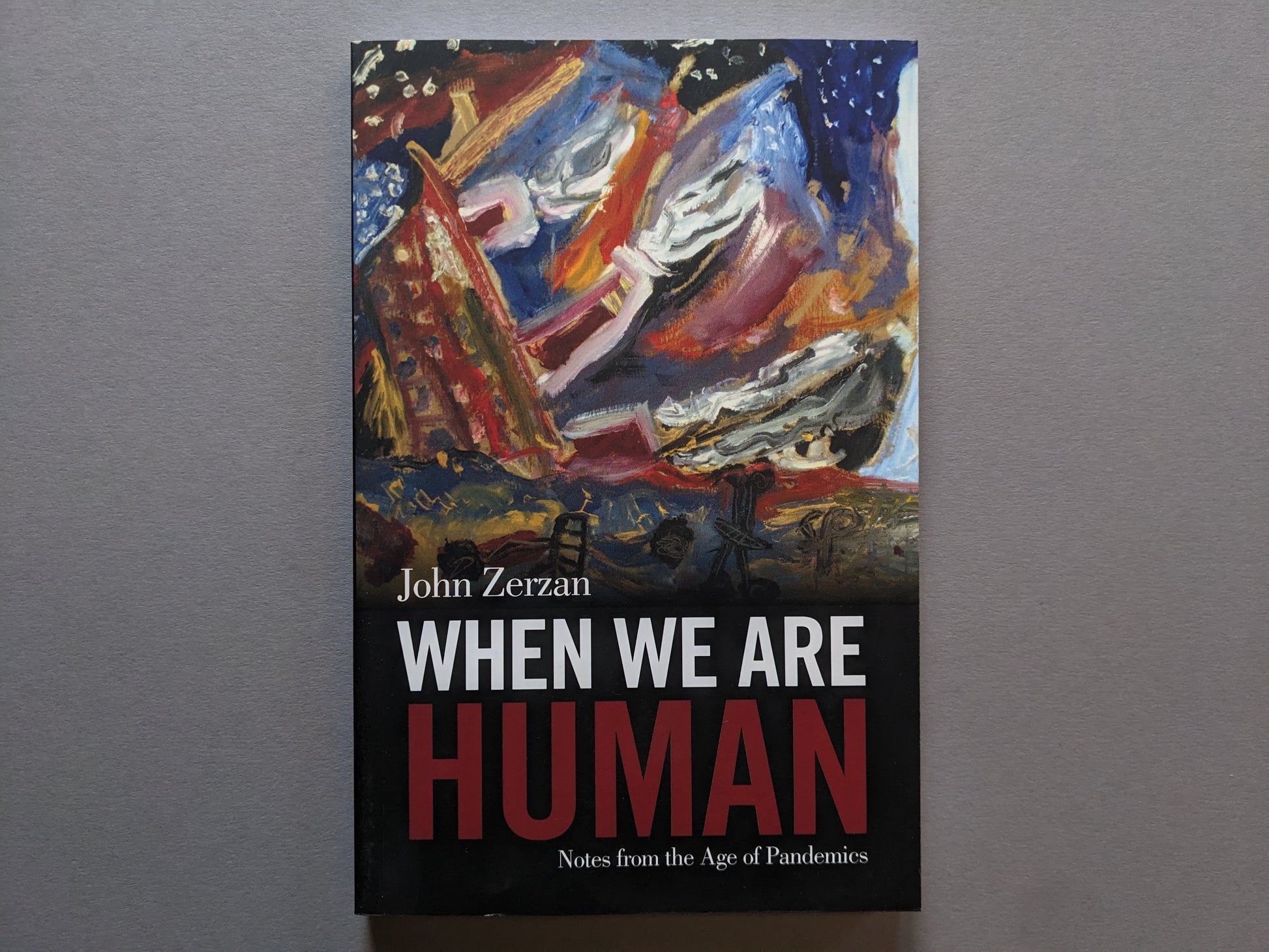 Cover of When We Are Human by John Zerzan – abstract painting with bold title typography