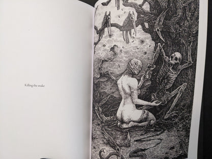 “Killing the snake” spread from Where Shadows Breathe: The Art of Melf, black-and-white scene with a kneeling figure, skeleton, and snake motifs.