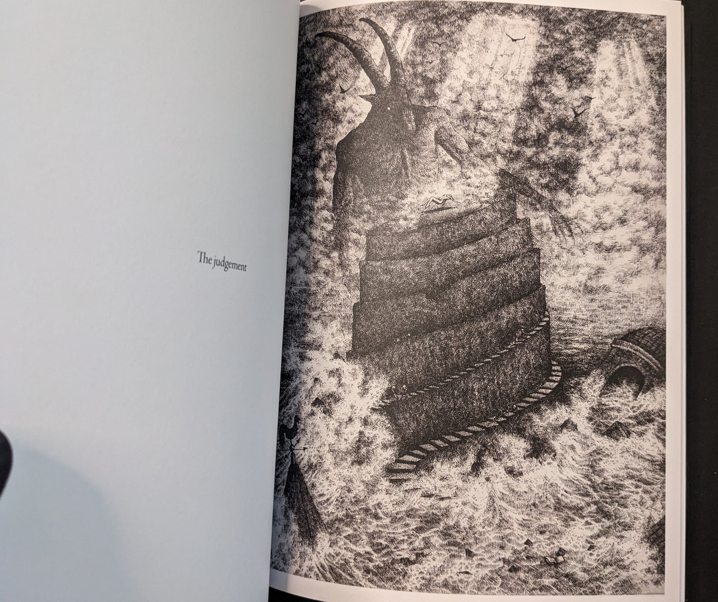 “The judgement” spread from Where Shadows Breathe: The Art of Melf, black-and-white illustration of a tower beneath a looming horned figure.