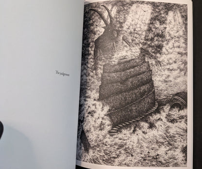 “The judgement” spread from Where Shadows Breathe: The Art of Melf, black-and-white illustration of a tower beneath a looming horned figure.